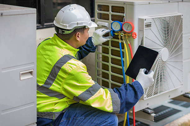 Professional Emergency Hvac Repair technician working in Hooper, UT
